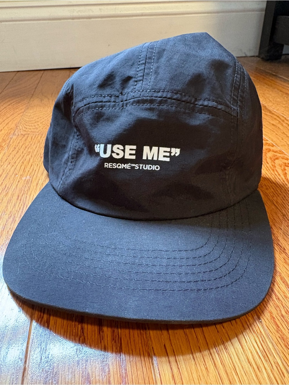 "USE ME" Black Panel Cap with RESQME STUDIO Logo